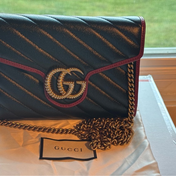 Gucci Handbags - Gucci Black and Gold Chain Bag with Red Trim